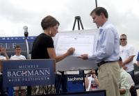 Image Of Michelle Bachman Signing Lean Six Sigma Pledge